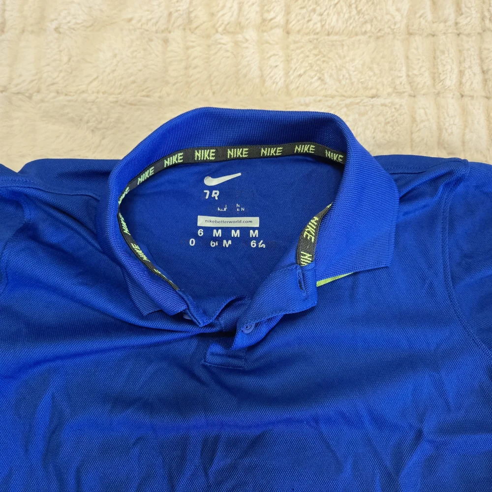 Nike DriFit Kids Medium Polo Shirt in Vibrant Blue W Volt Yellow Logo